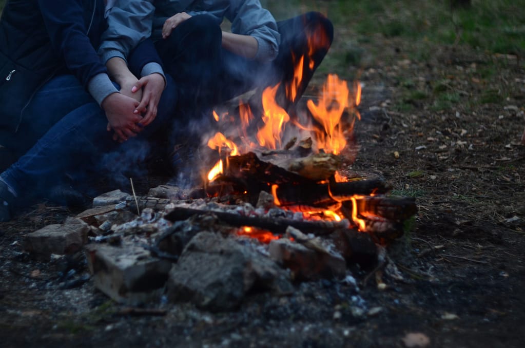 A campfire dinner by the lake at the end of a valentines day can make the date all that much more memorable.